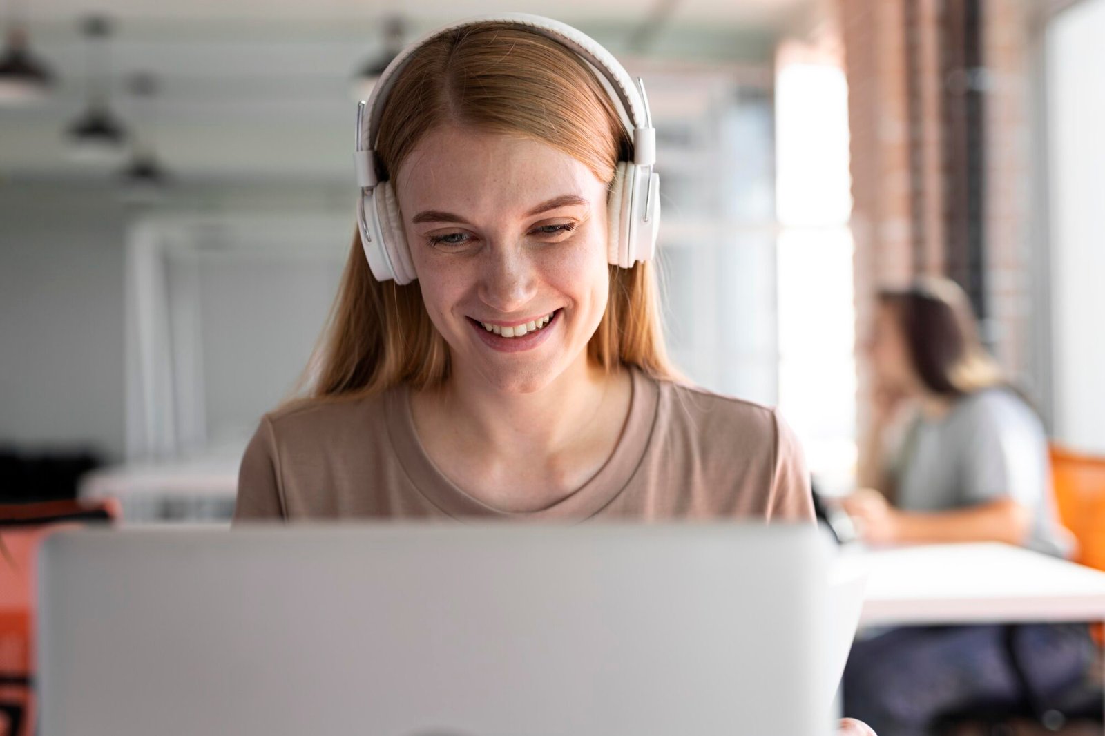medium-shot-smiley-woman-wearing-headphones